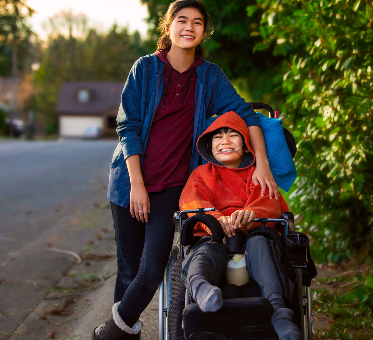 mother and son in wheelchair outside